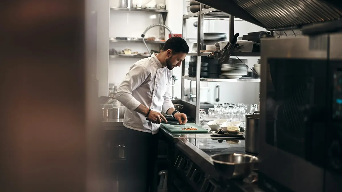 Bahrain Salary Guide 2026: Pay by Job, Benefits & Cost of Living Chef at work in a restaurant kitchen