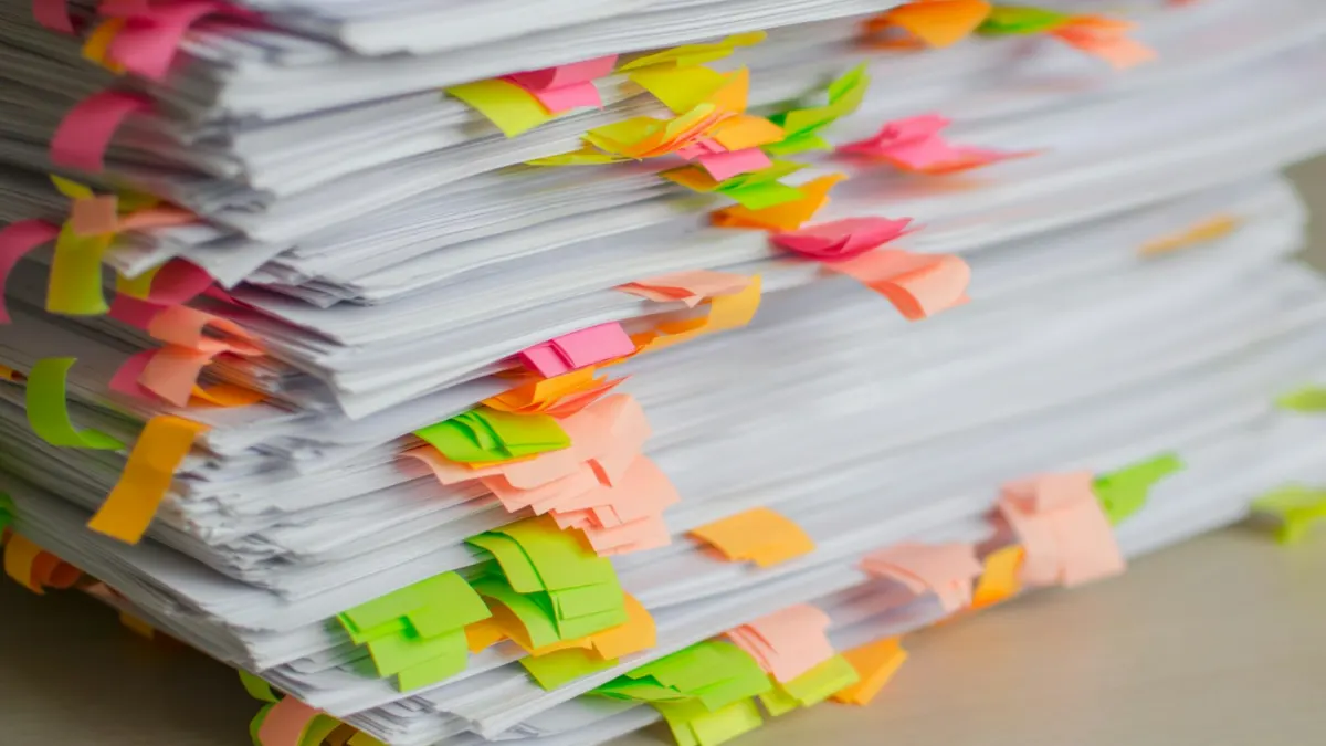 Employee completing paperwork in an office