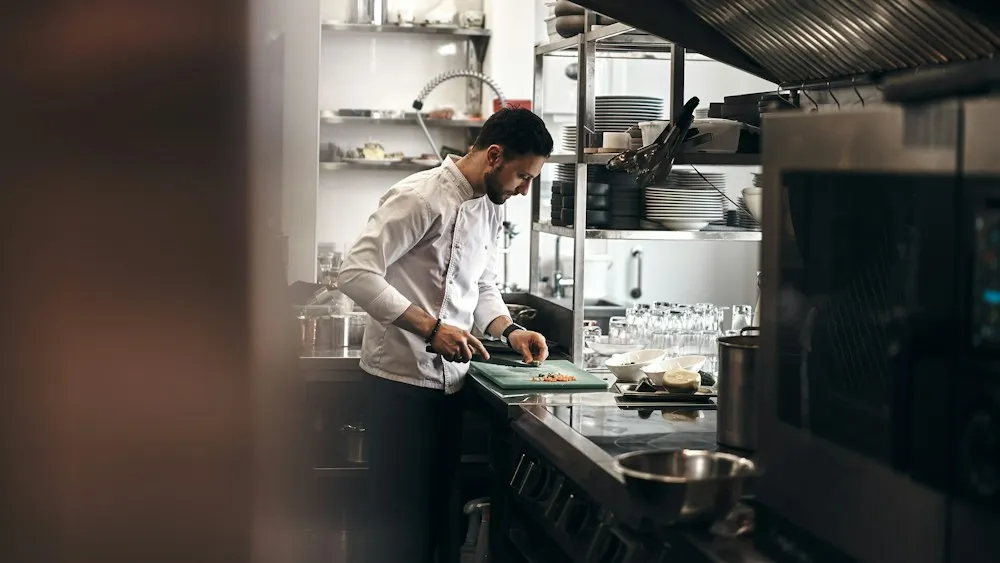 Hotel Jobs in Dubai: 10 Best Roles & Easy Steps to Apply in 2026 Chef cooking in a hotel kitchen – chef jobs in Dubai