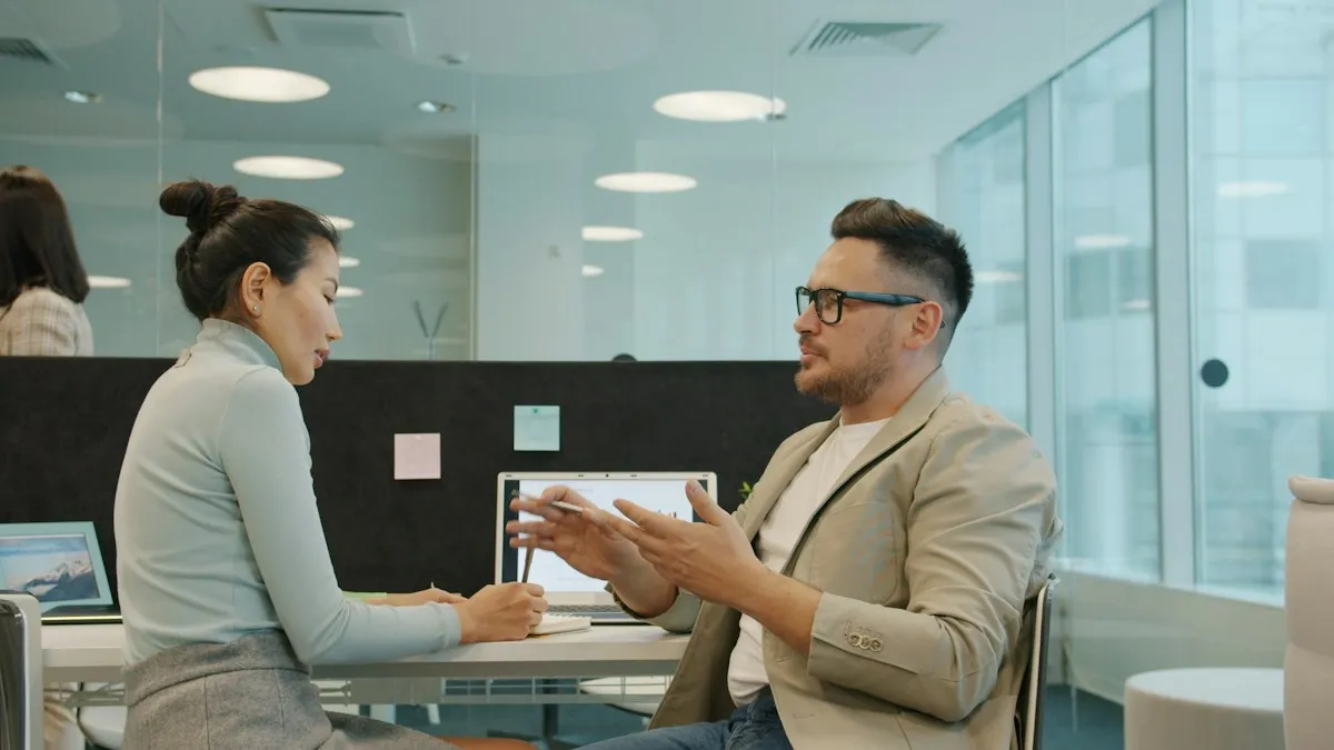 Interview questions – two colleagues discussing in an office interview