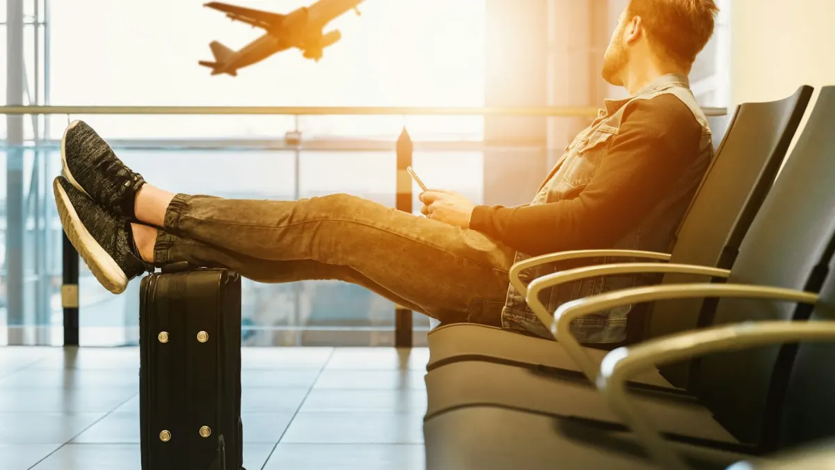 Kuwait Work Visa for Indians 2026: Process, Documents, Medical & Civil ID Traveller with passport at the airport – moving to Kuwait for work