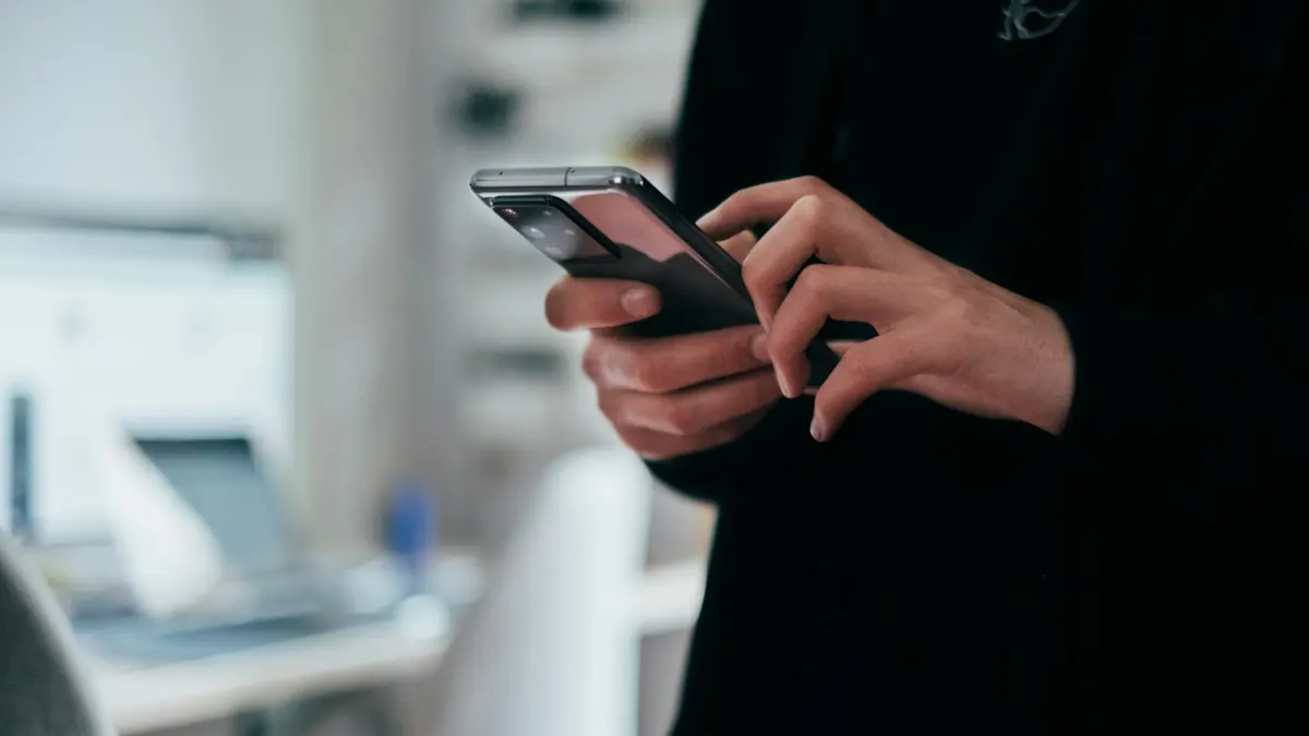 MOHRE Job Offer Verification 2026: How to Check a UAE Offer Letter Online Smartphone in hand – checking UAE work permit status online