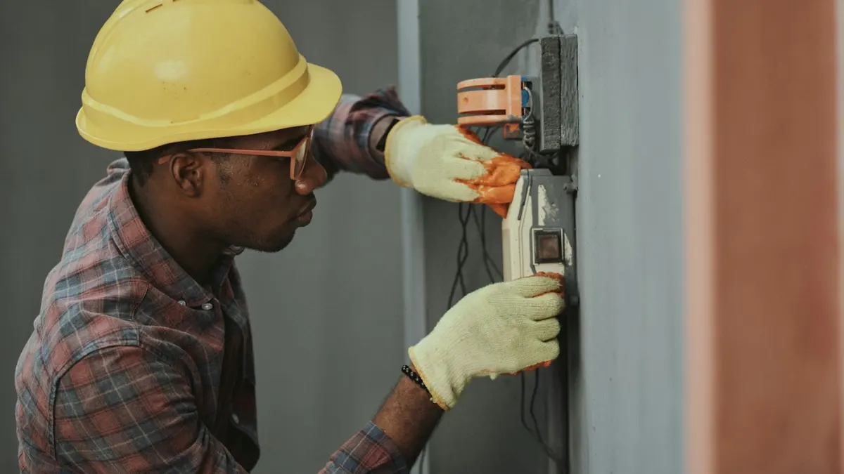 Electrician installing cables at a building site