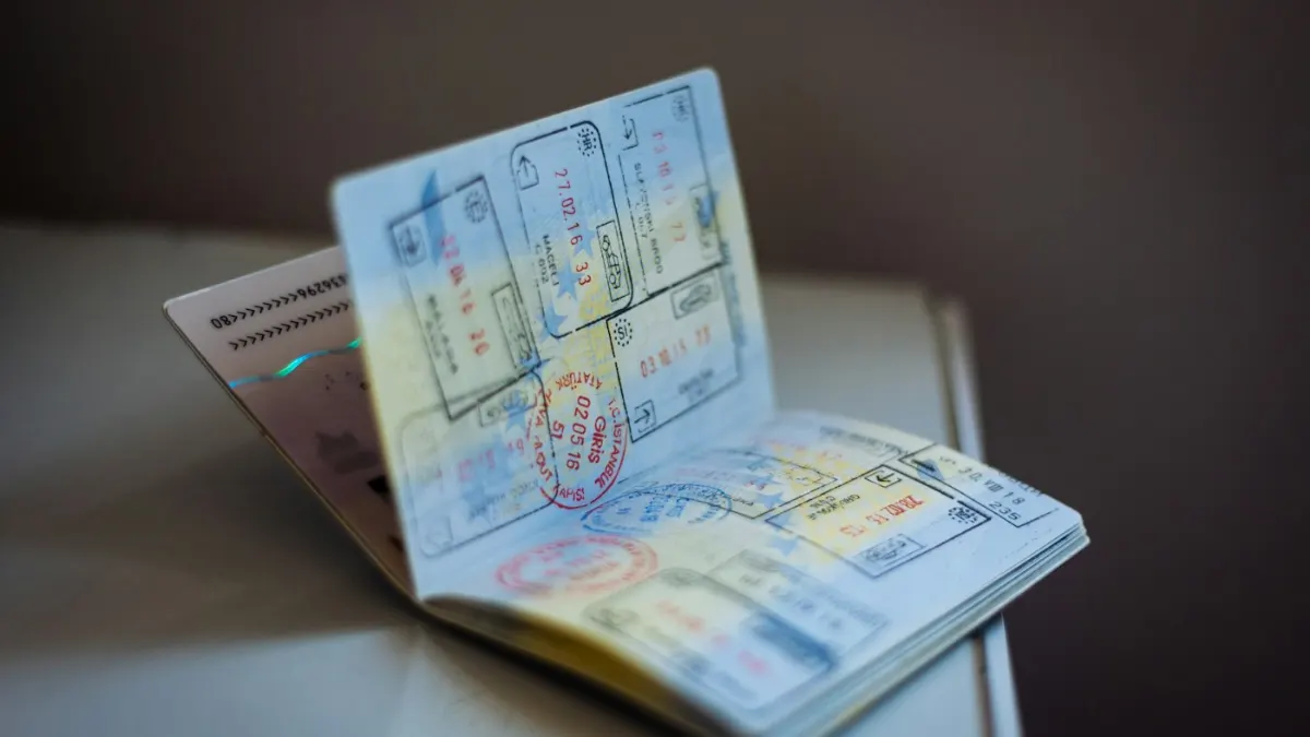 Qatar Work Visa Process 2026: QVC Steps, Documents, Fees & Rules Passport and boarding pass – travelling to Doha for work
