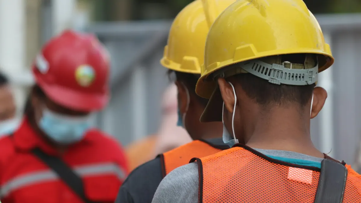 Construction workers wearing protective equipment
