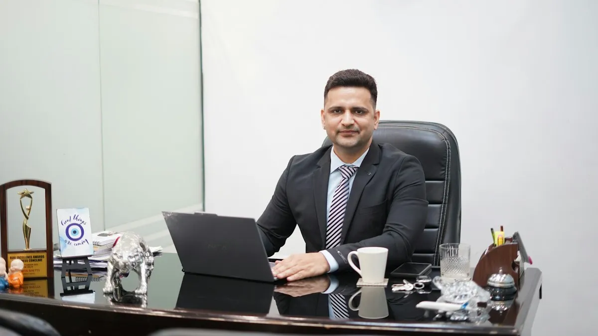 UAE jobs for Indians – professional in a suit at an office desk